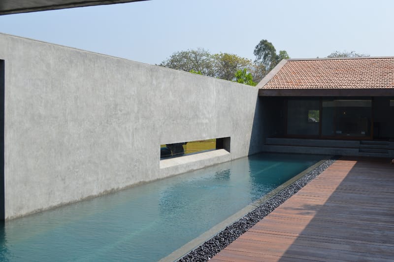 Pool crafted with deck and curtain wall